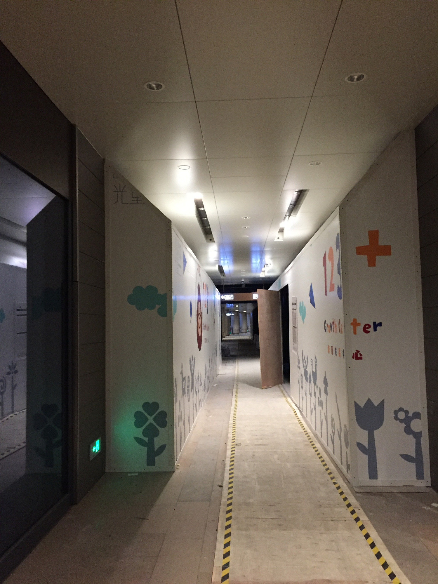 Public mall corridor during construction, before the completed entrance and curved wall treatment.
