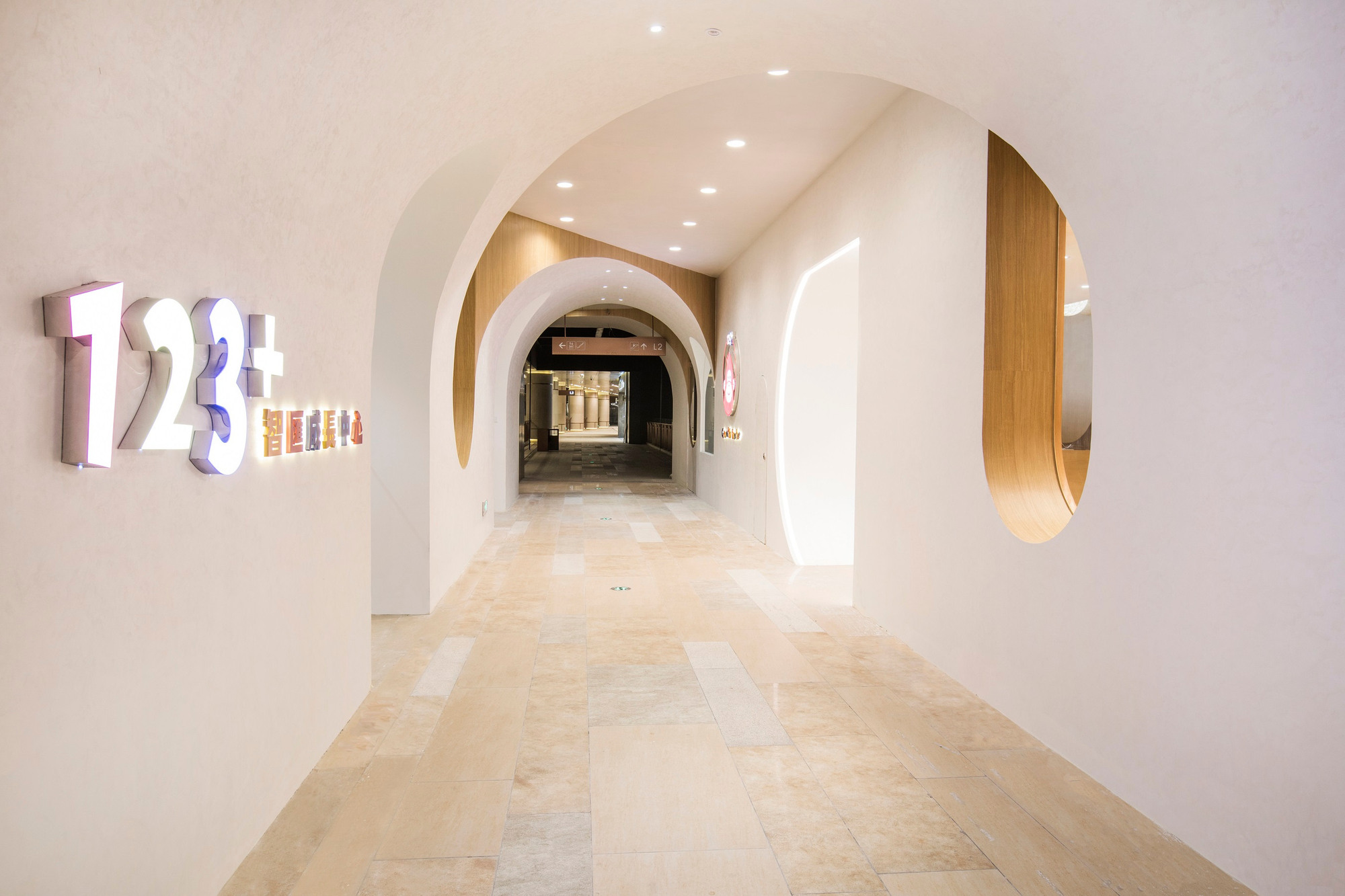 Completed public corridor and the curved entrance to the education center.
