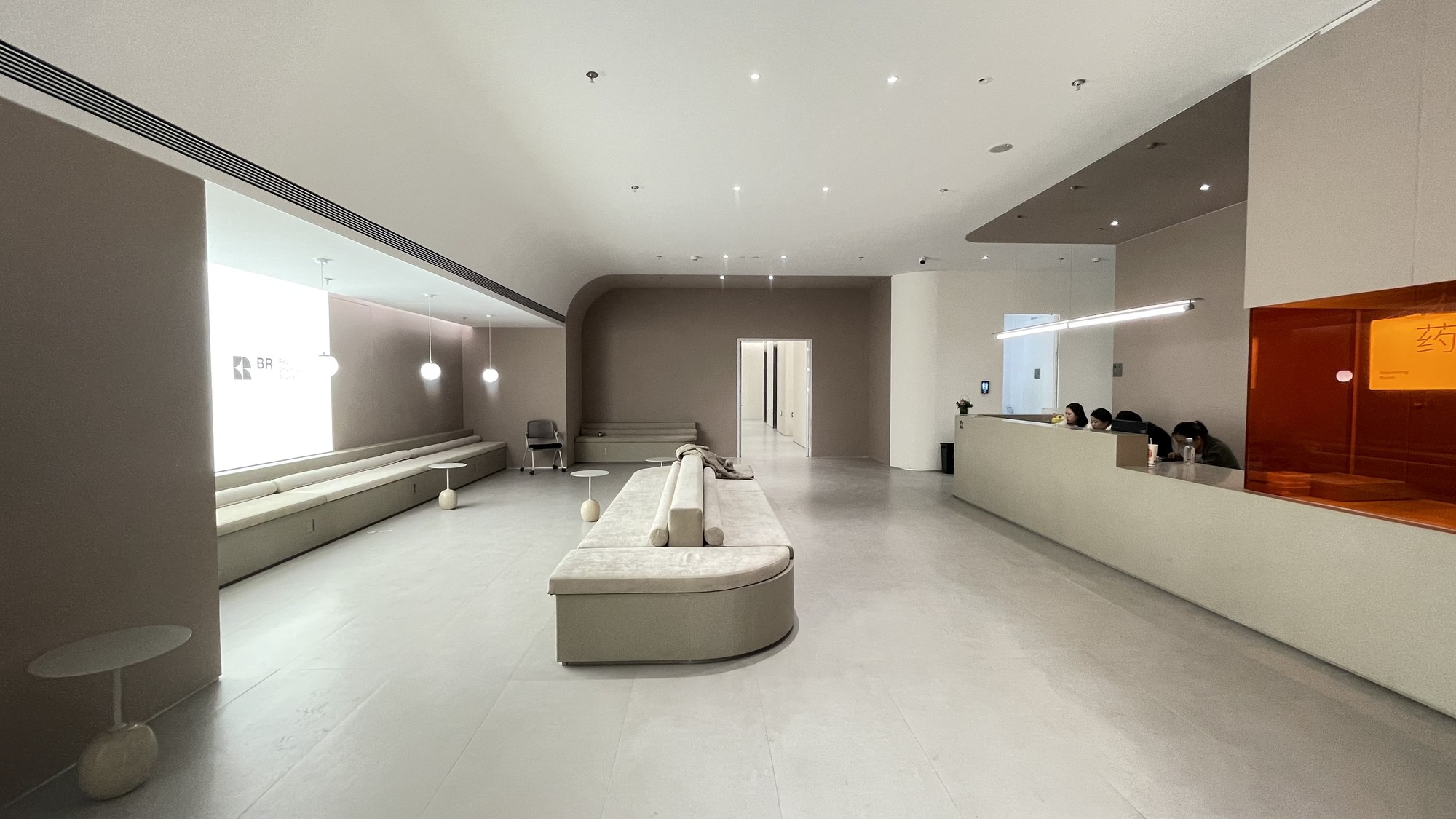 Site photograph of the reception and waiting area after the main interior finishes were installed.