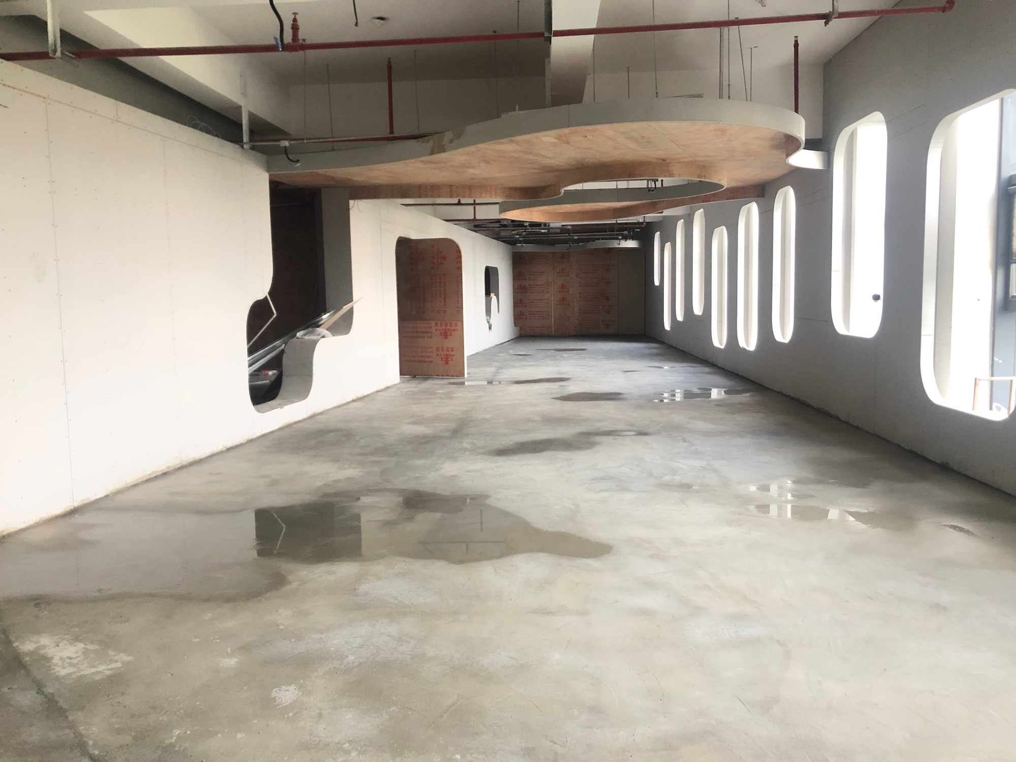 The open gallery during construction, before the final floor finish and completed display installation.