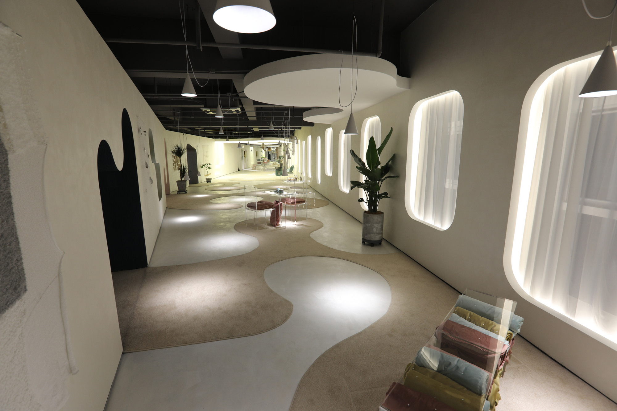 The completed open gallery links separate product-display rooms.