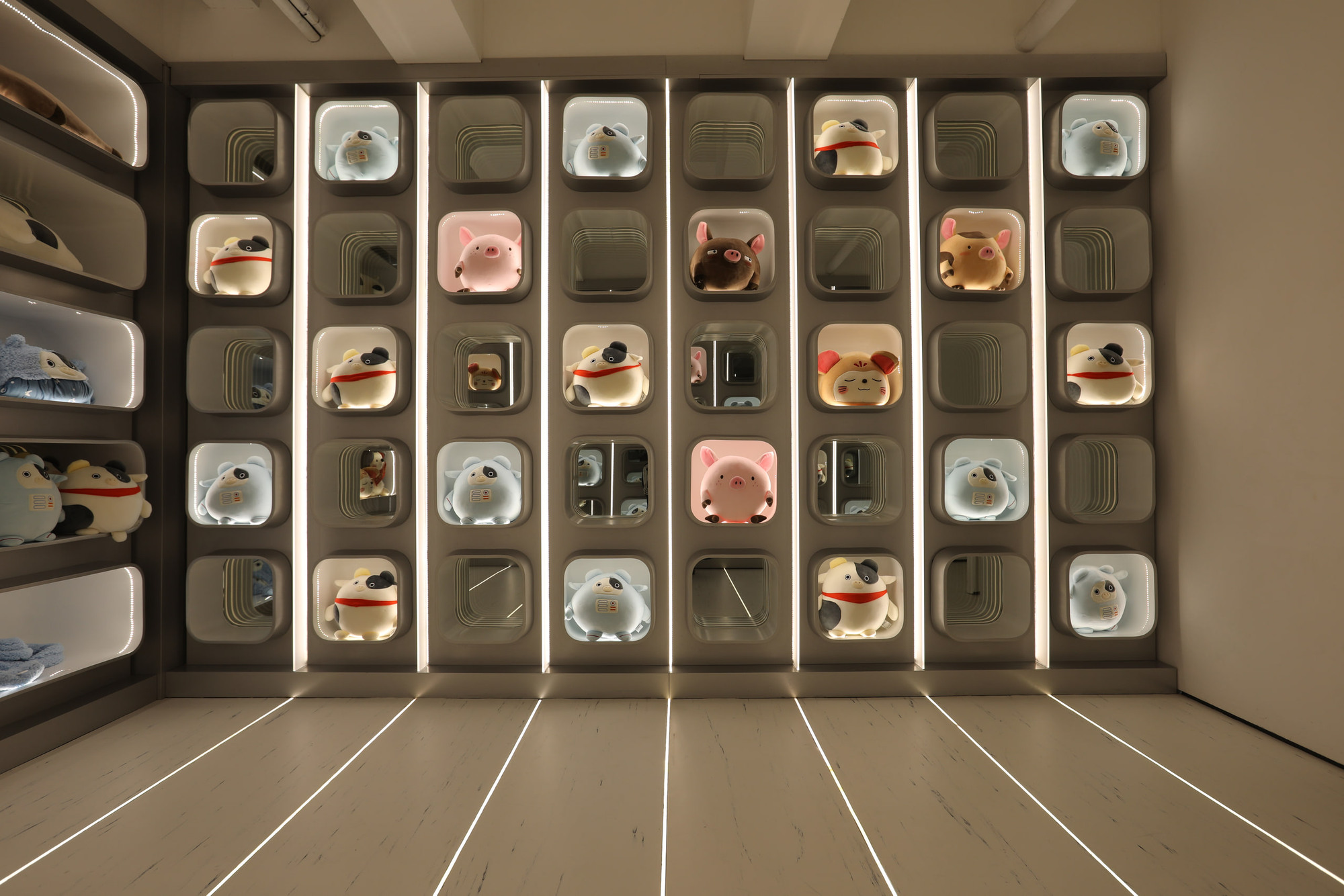 Recessed, illuminated modules frame individual products.